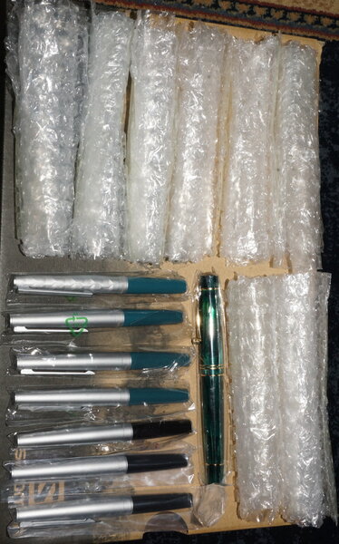 A Moonman 800 and seven Moonman 80 Mini pens freed from bubble wrap